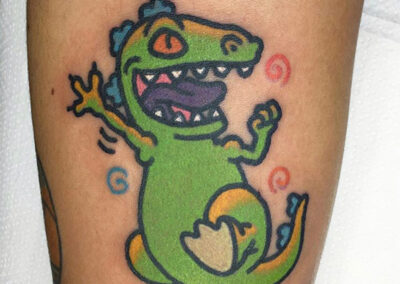 cartoon tattoo de dinosaurio