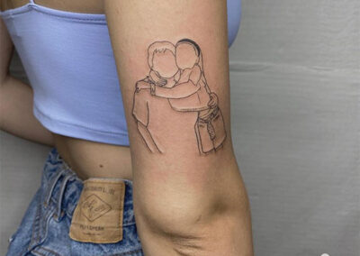 Tatuajes finos de padre e hija