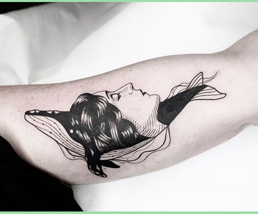 Tatuaje Black work tattoo de rostro de una mujer fundido en el perfil de una ballena | Tatuaje Black Work | Estilos de tatuaje | Cornelius Tattoo
